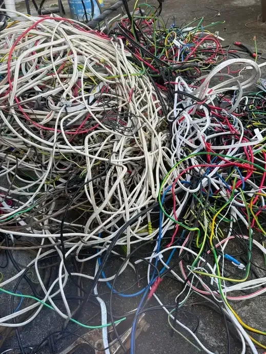 Mixed insulated cable and wire stripped out and piled up ready for grading.