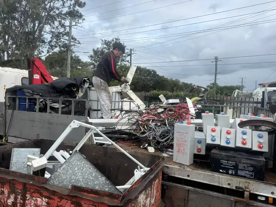 Lead acid batteries and cable sorted on the truck tray, ready for recycling.
