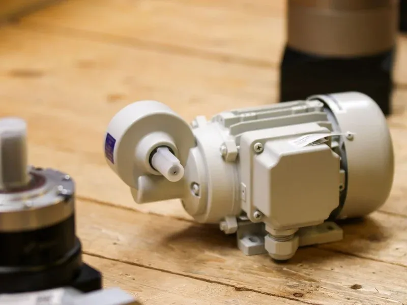 An electric motor and gearbox housing set aside for copper recovery.
