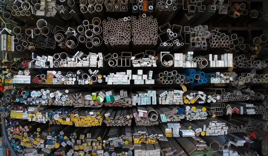 Metal stock sorted by grade and profile into separate racks.
